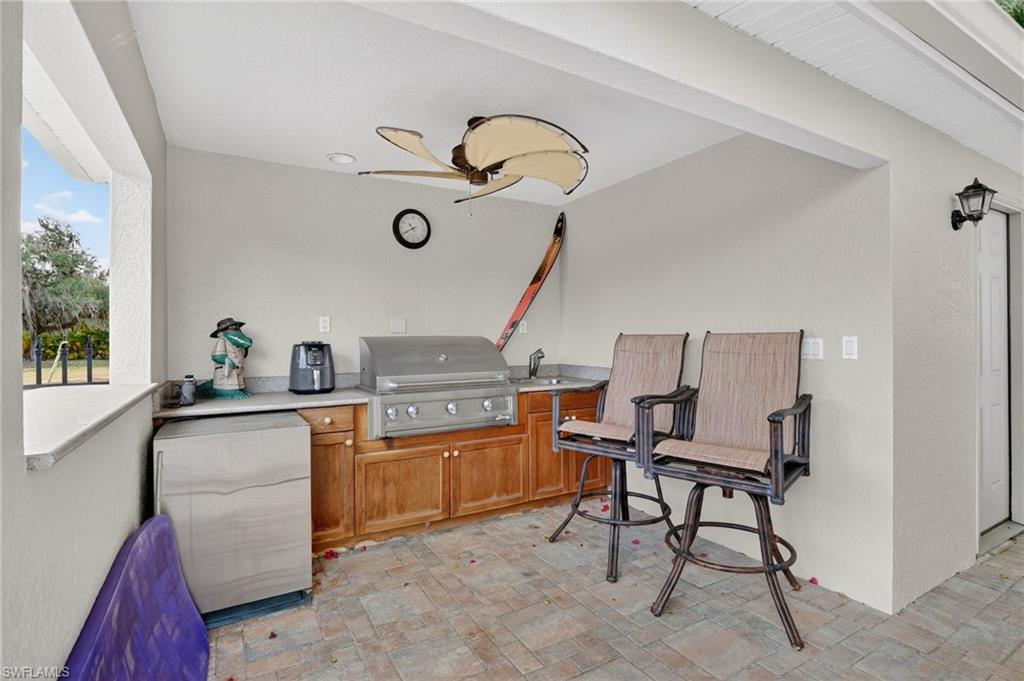 1964 Rialto Way Alva, FL 33920 - Photo 35 of 50 a bed room with a chair and gym equipment