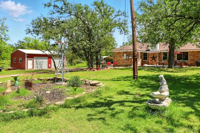 a view of a house with a yard porch and sitting area