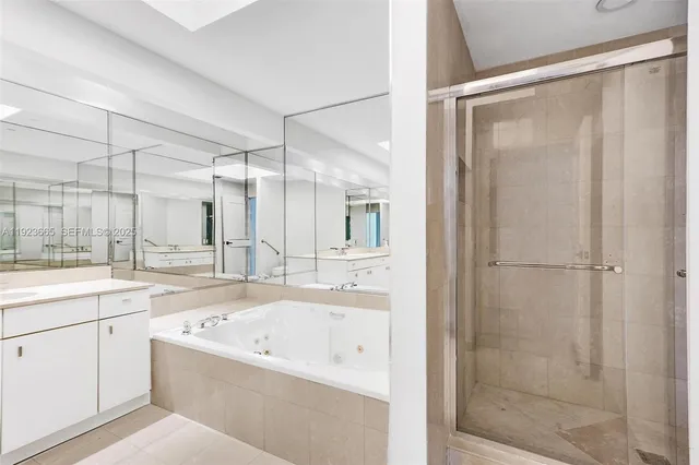 a bathroom with a glass shower door
