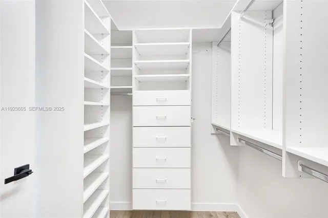 a bedroom with a bed and a cabinets