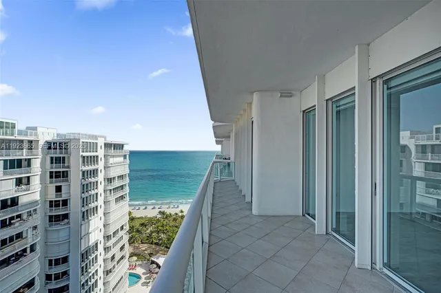 a view of swimming pool from a balcony