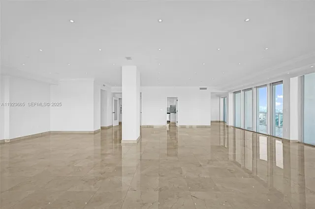 a view of an empty room with glass door