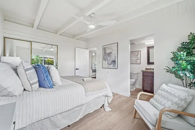 a bedroom with a bed and a couch