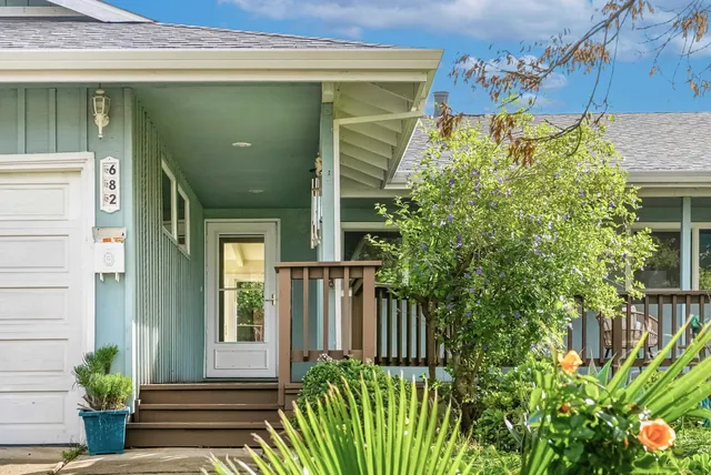 a view of a house with a flower plants