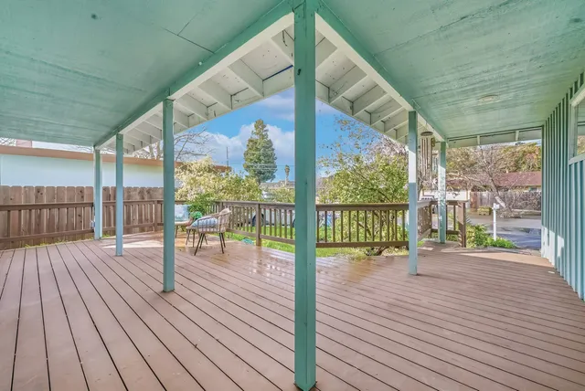 a balcony with wooden floor