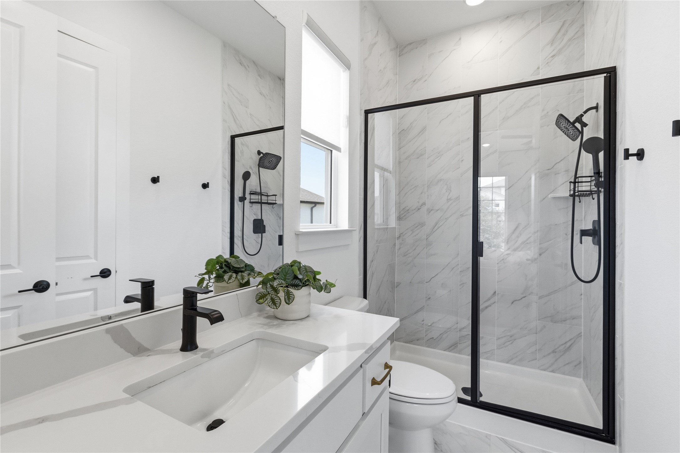 836 Villa Rialto View Leander, TX 78641 - Photo 24 of 33 A well-appointed bath features a sleek vanity, modern fixtures, and a spacious glass-enclosed shower.