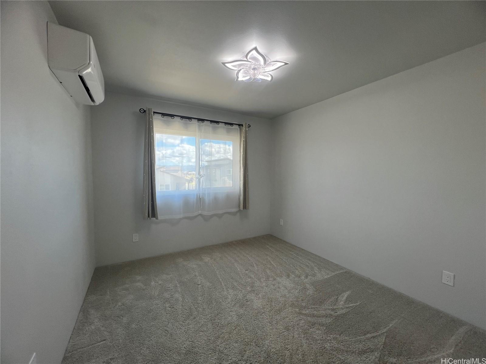 91-1640 Honouliuli Street, Unit 66 Ewa Beach, HI 96706 - Photo 11 of 20 an empty room with a empty space and windows