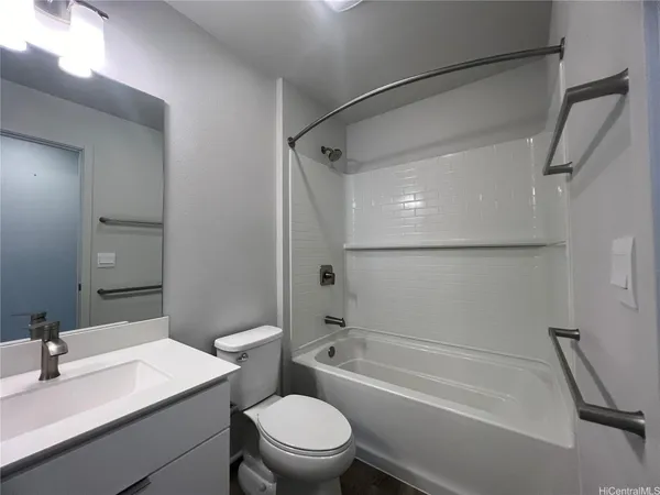 a bathroom with a sink toilet and a bathtub
