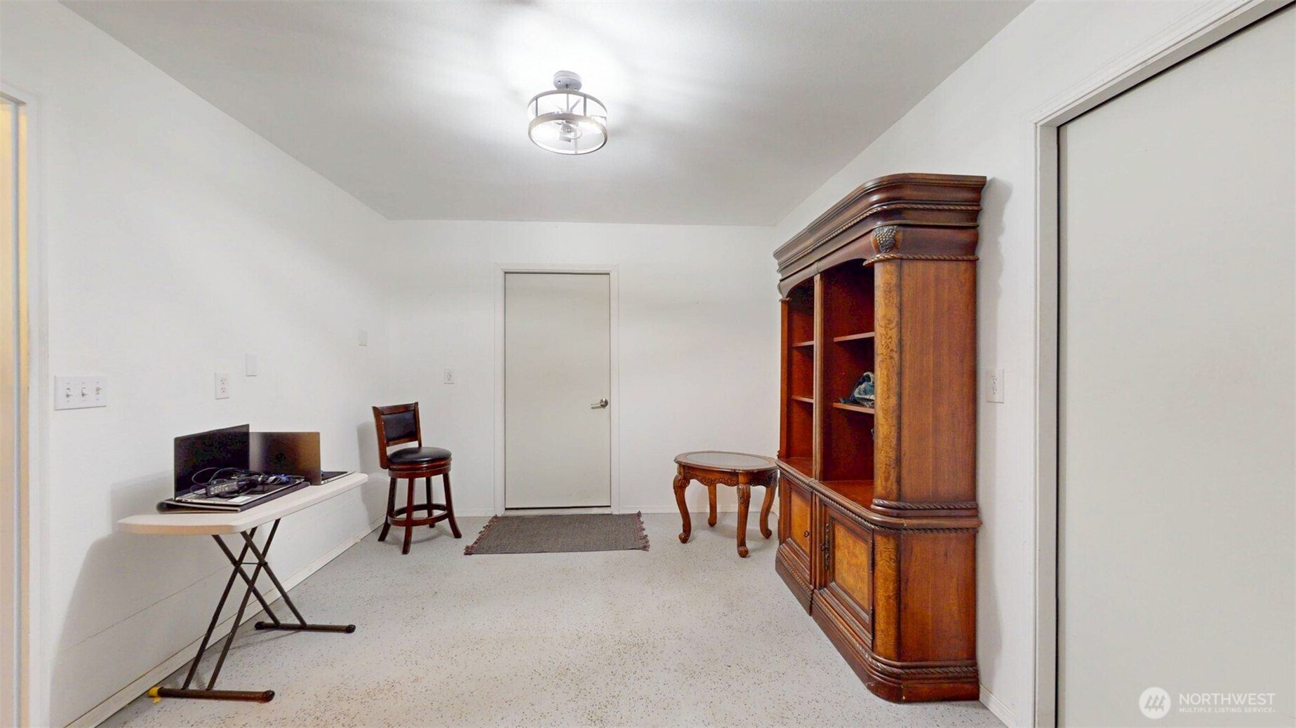 46 Shumway Road Omak, WA 98841 - Photo 22 of 40 a view of a workspace with furniture and a window