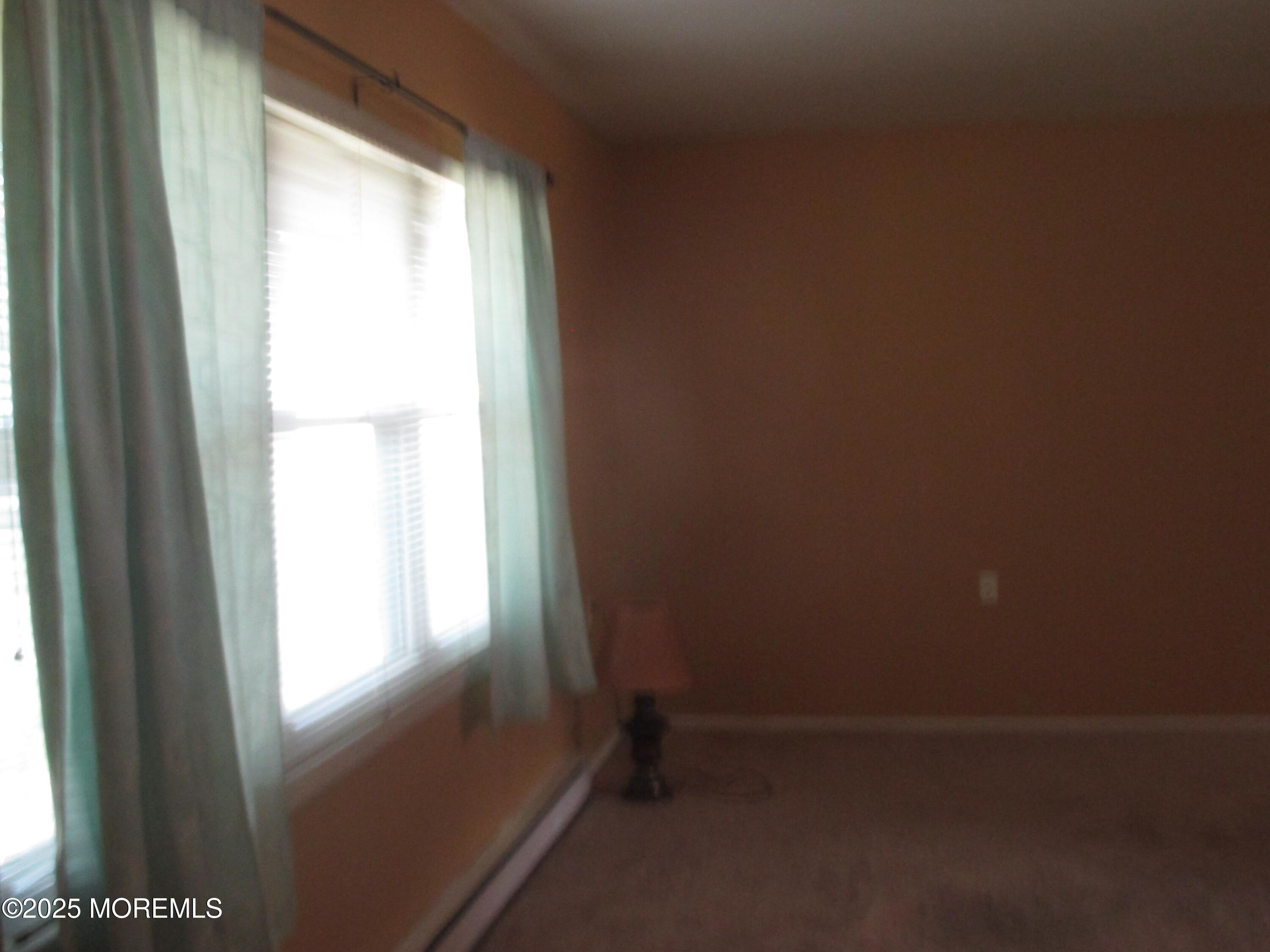 662 A Plymouth Drive Lakewood, NJ 08701 - Photo 11 of 21 a view of an empty room and a window
