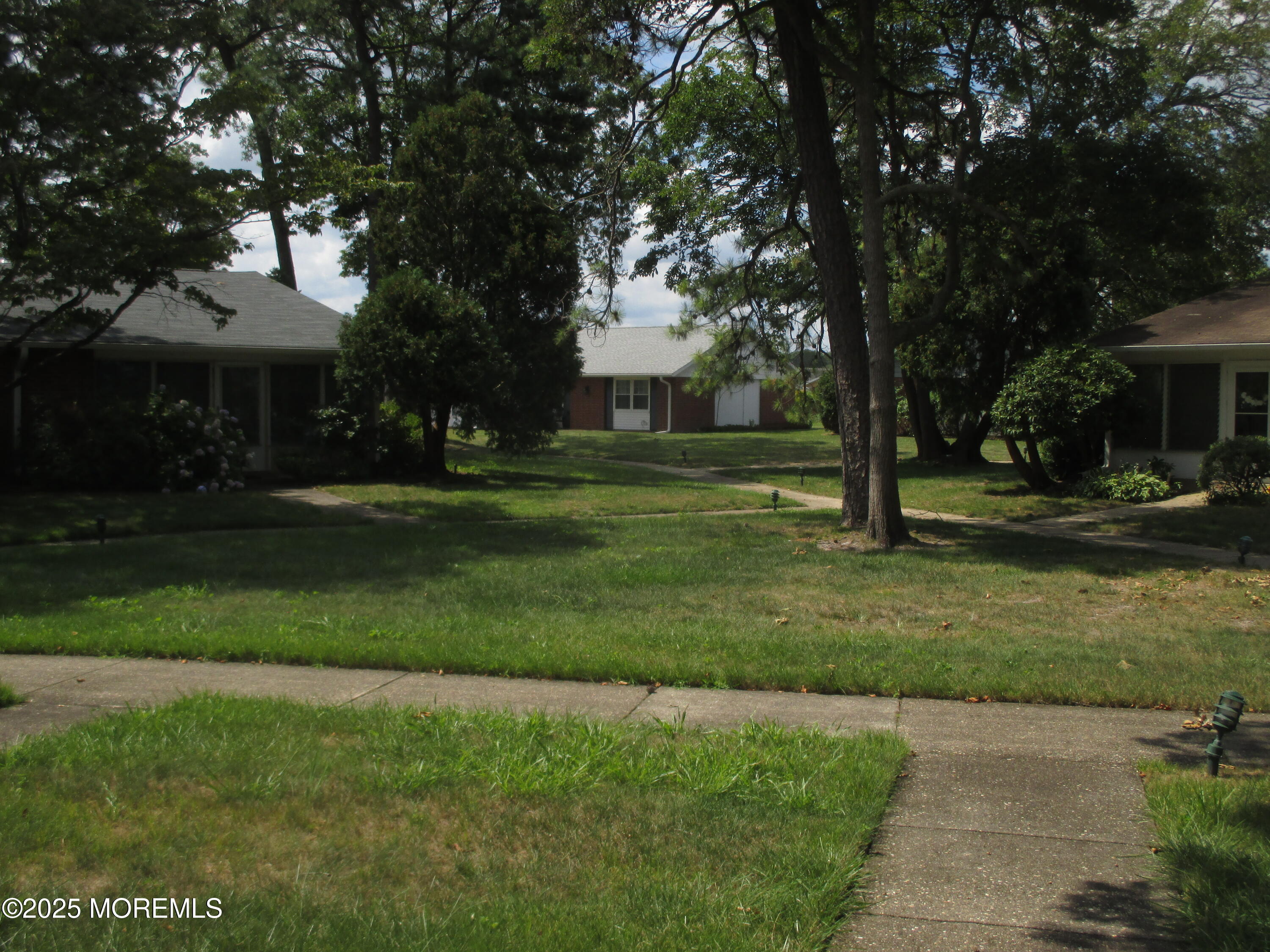 662 A Plymouth Drive Lakewood, NJ 08701 - Photo 2 of 21 a front view of a house with a yard