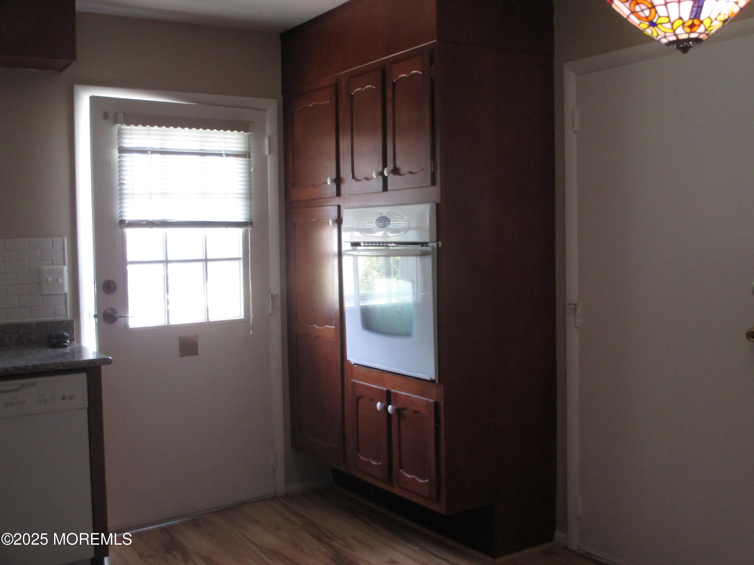 662 A Plymouth Drive Lakewood, NJ 08701 - Photo 4 of 21 a kitchen with a refrigerator and window