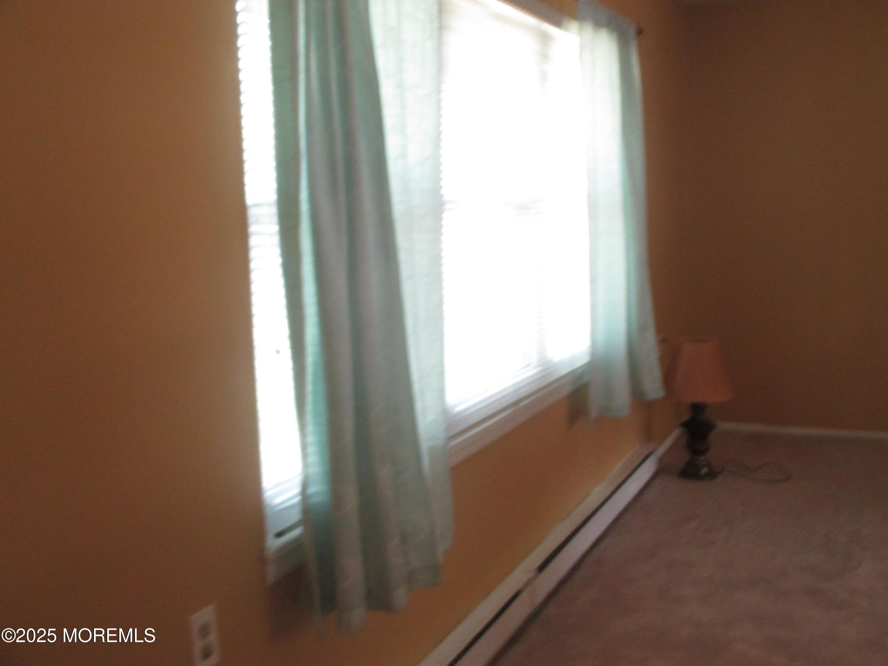 662 A Plymouth Drive Lakewood, NJ 08701 - Photo 10 of 21 a view of an empty room and a window