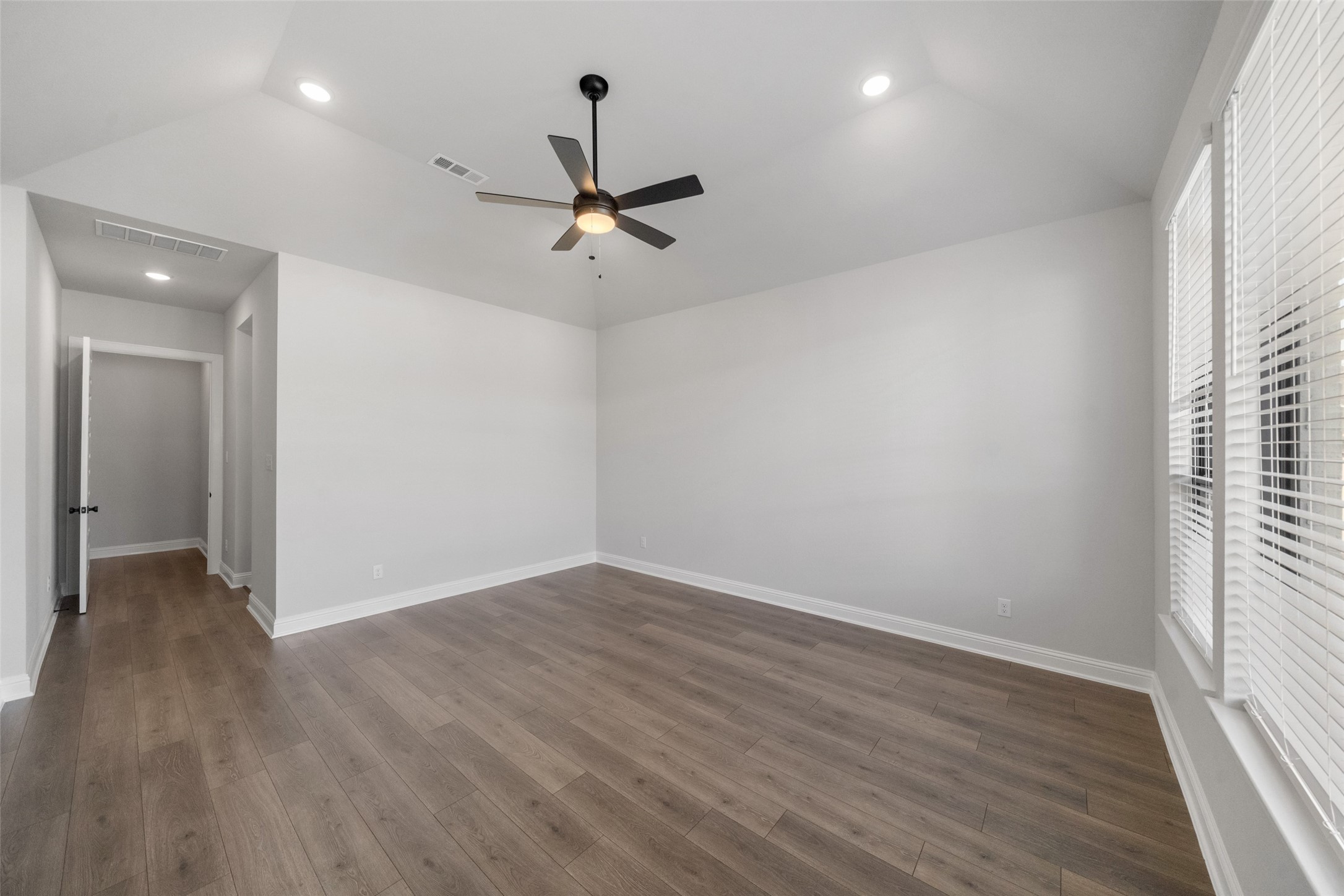 15464 Ringbill Way Magnolia, TX 77354 - Photo 23 of 37 wooden floor in an empty room with a window