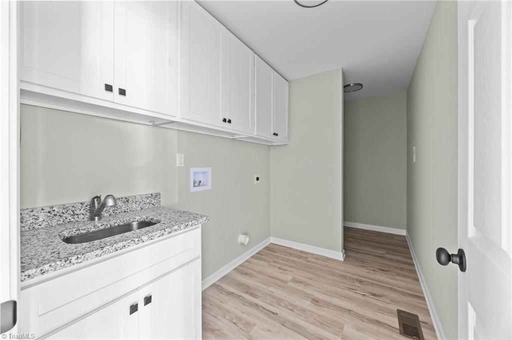 1700 Bringle Ferry Road Salisbury, NC 28146 - Photo 8 of 19 Laundry room with utility sink and additional storage