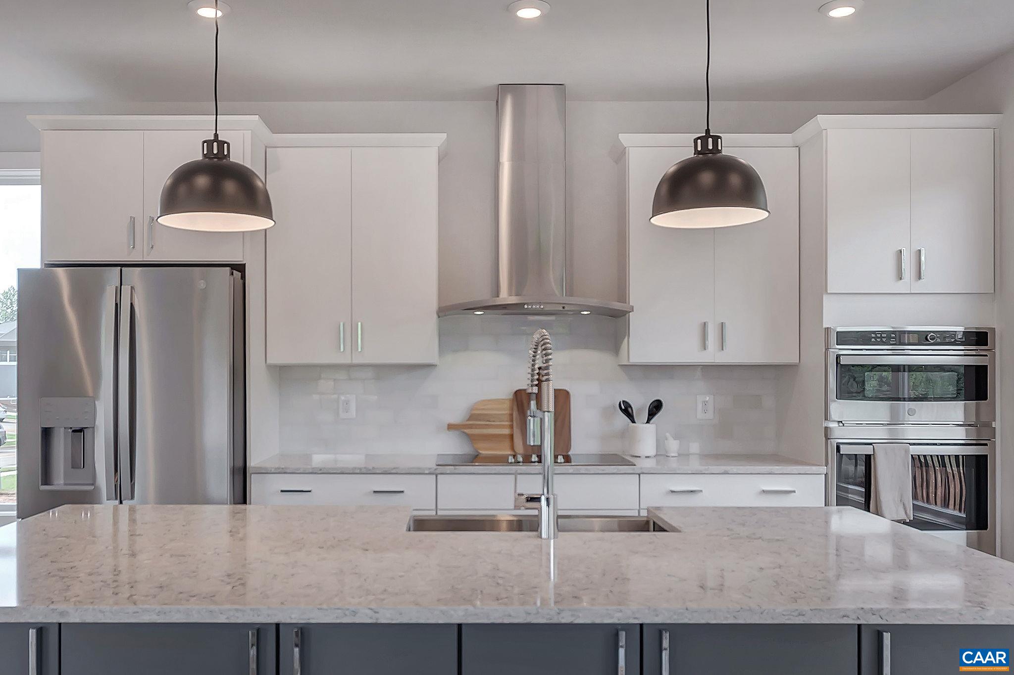 31 B Fowler Street Charlottesville, VA 22901 - Photo 7 of 26 a kitchen with kitchen island a counter top space appliances and cabinets
