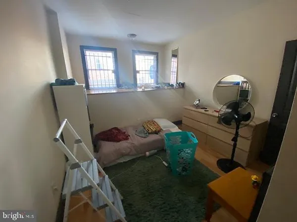 a living room with furniture and a mirror