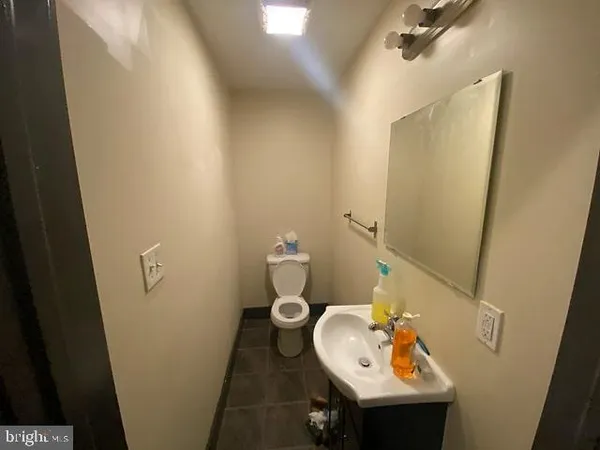 a bathroom with a sink and toilet
