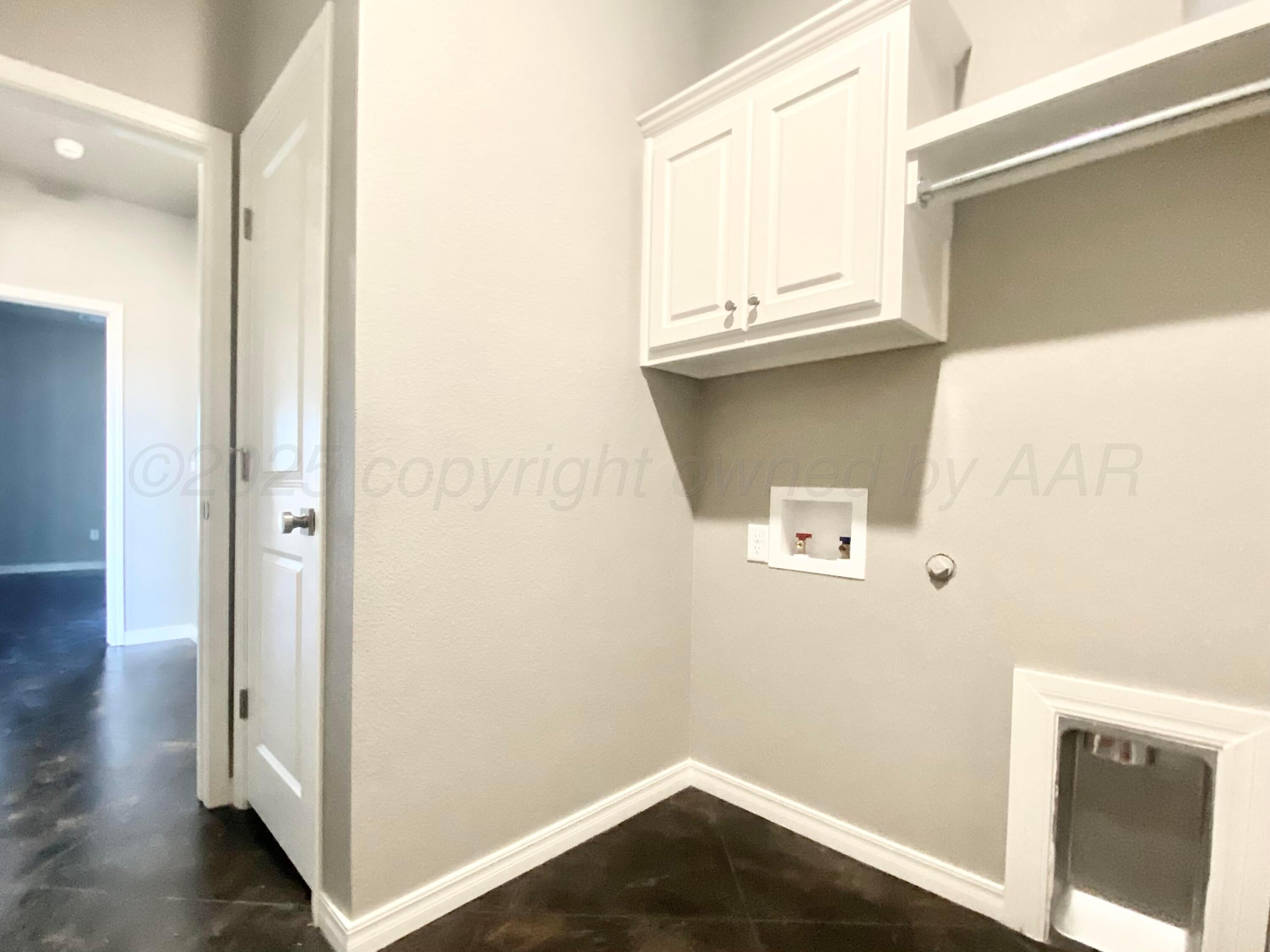 7517 John Thomas Street Amarillo, TX 79119 - Photo 17 of 20 a view of storage and utility room with wooden floor