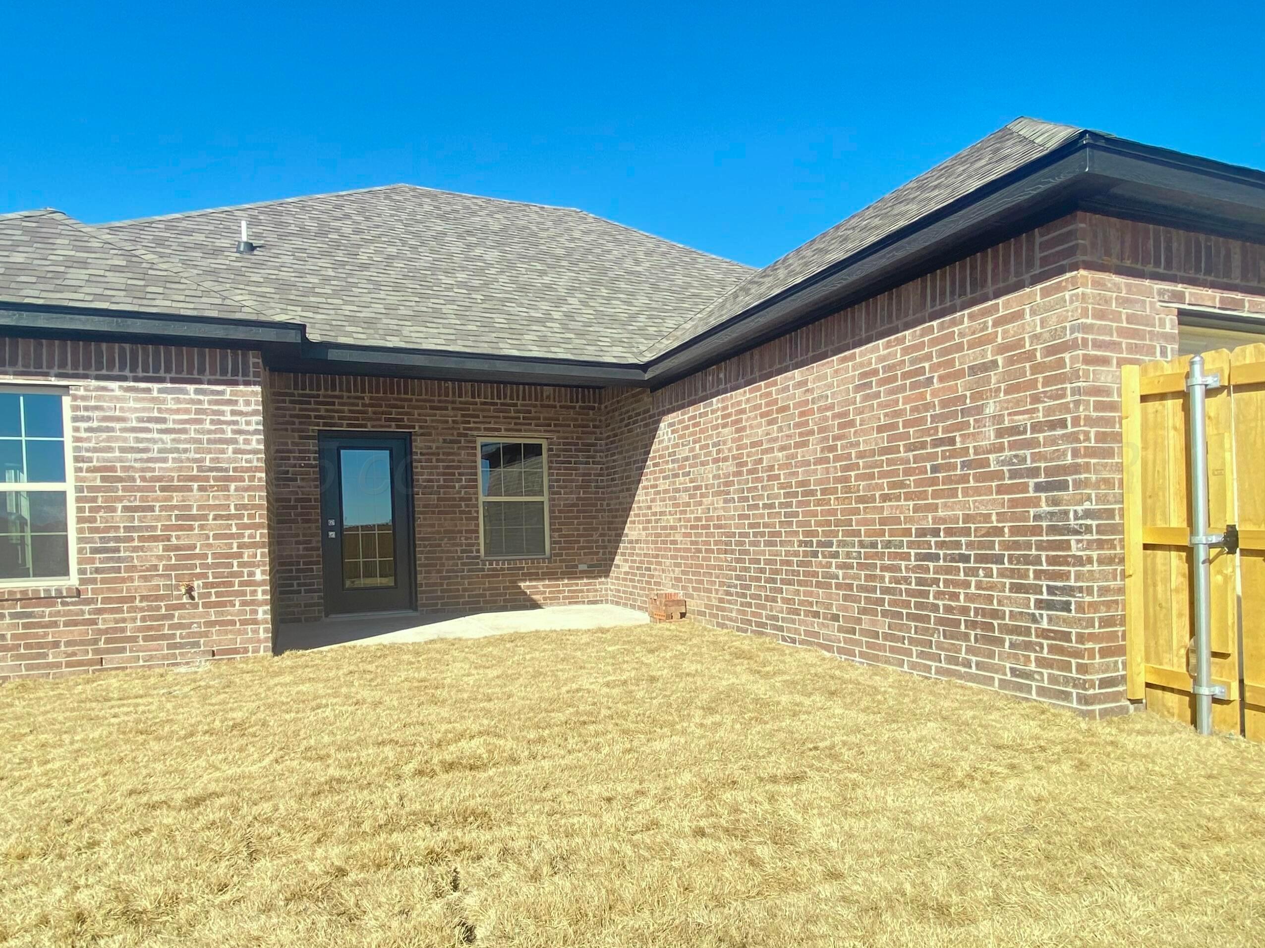 7517 John Thomas Street Amarillo, TX 79119 - Photo 18 of 20 a view of yellow house with a large window