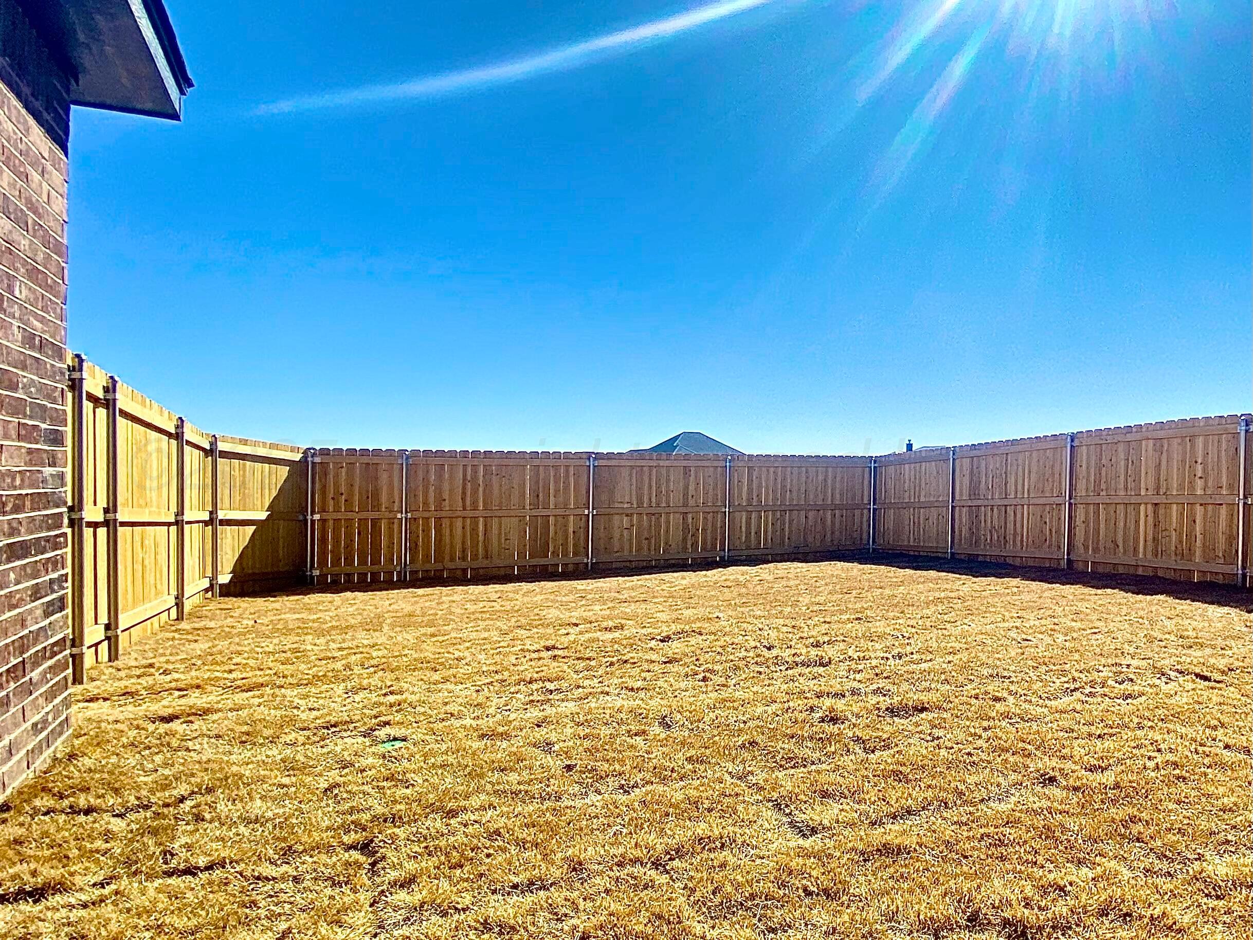 7517 John Thomas Street Amarillo, TX 79119 - Photo 19 of 20 a view of wooden fence