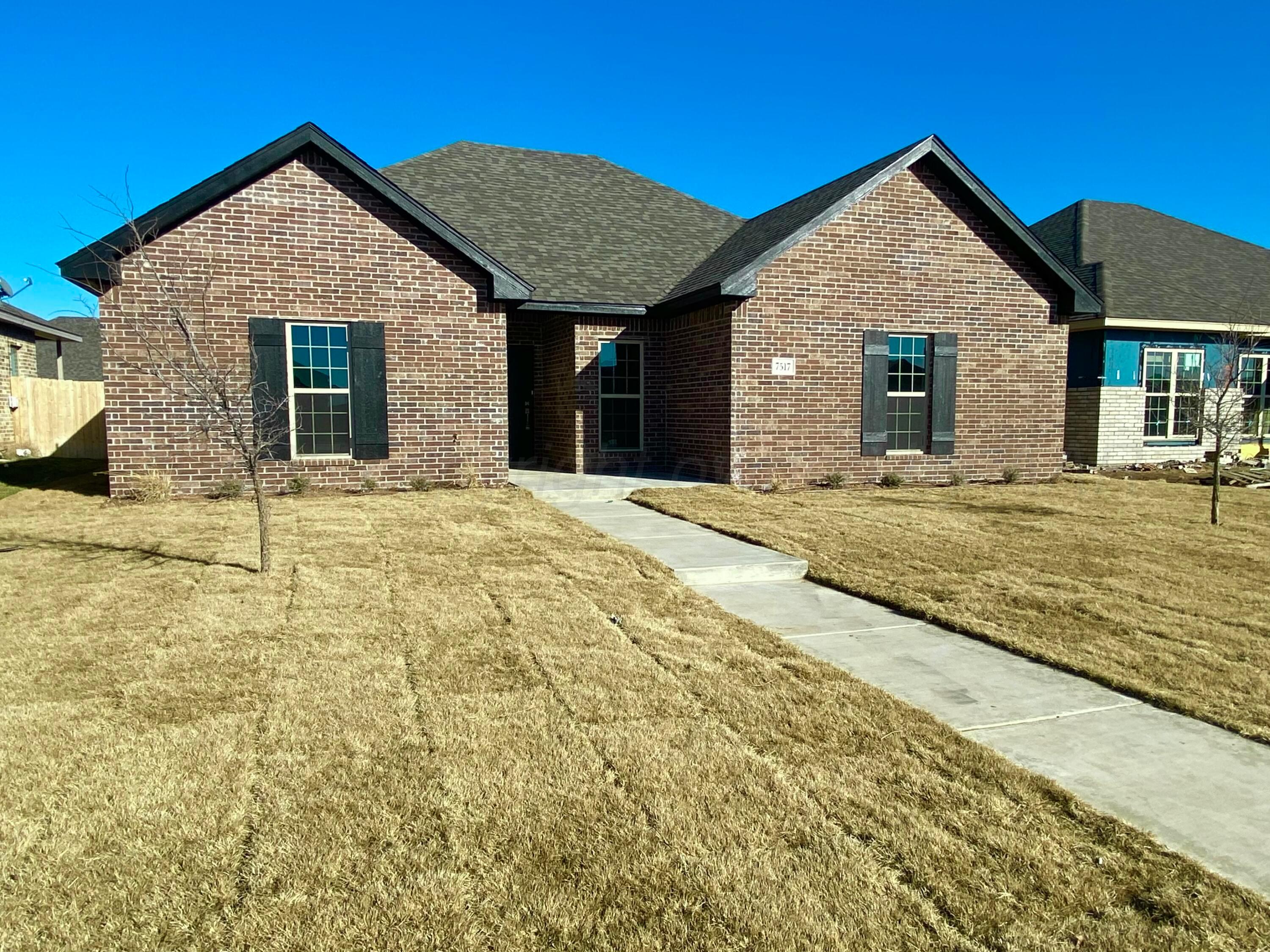 7517 John Thomas Street Amarillo, TX 79119 - Photo 20 of 20 a front view of a house with a outdoor space