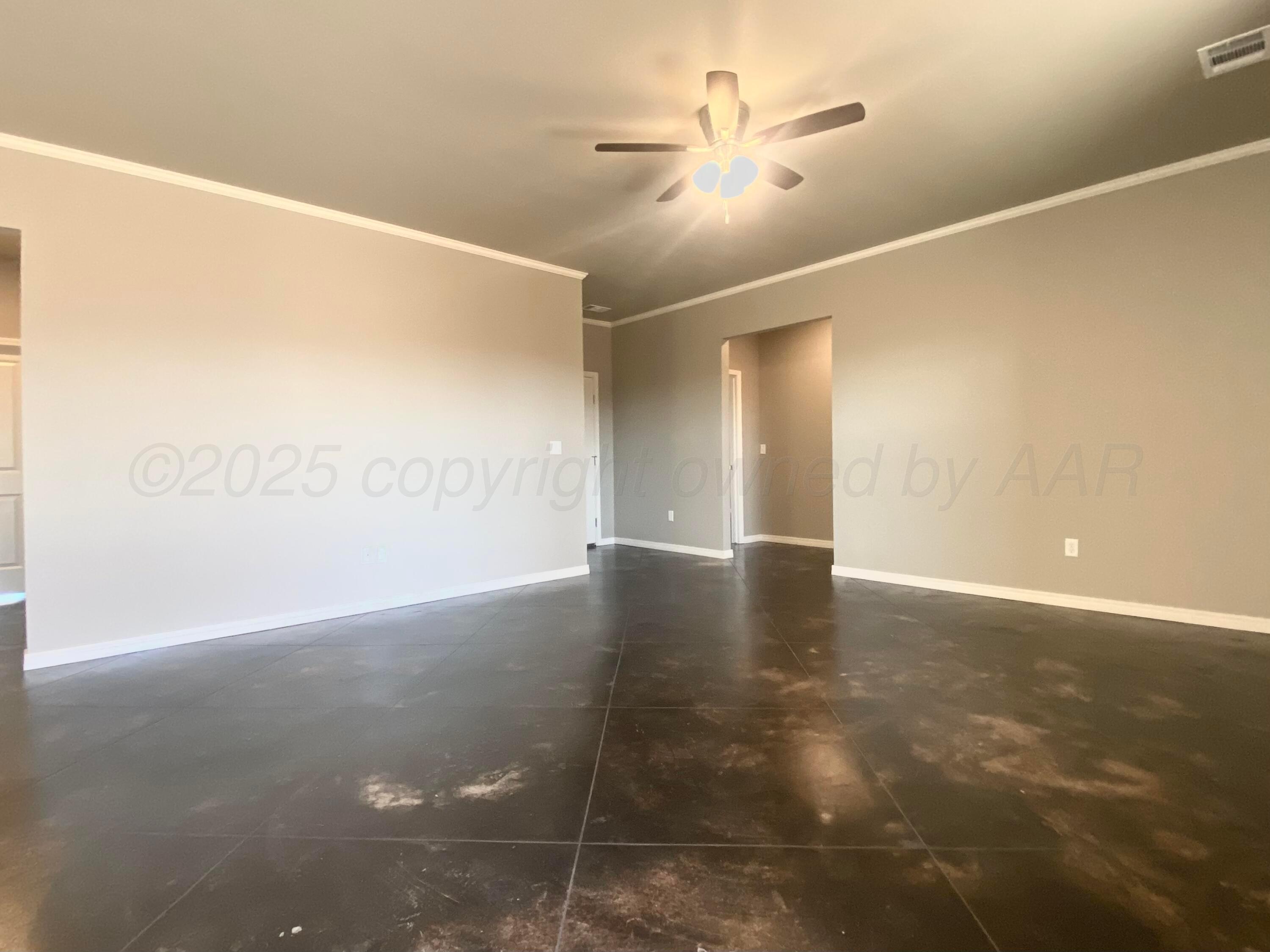 7517 John Thomas Street Amarillo, TX 79119 - Photo 3 of 20 a view of an empty room with a window