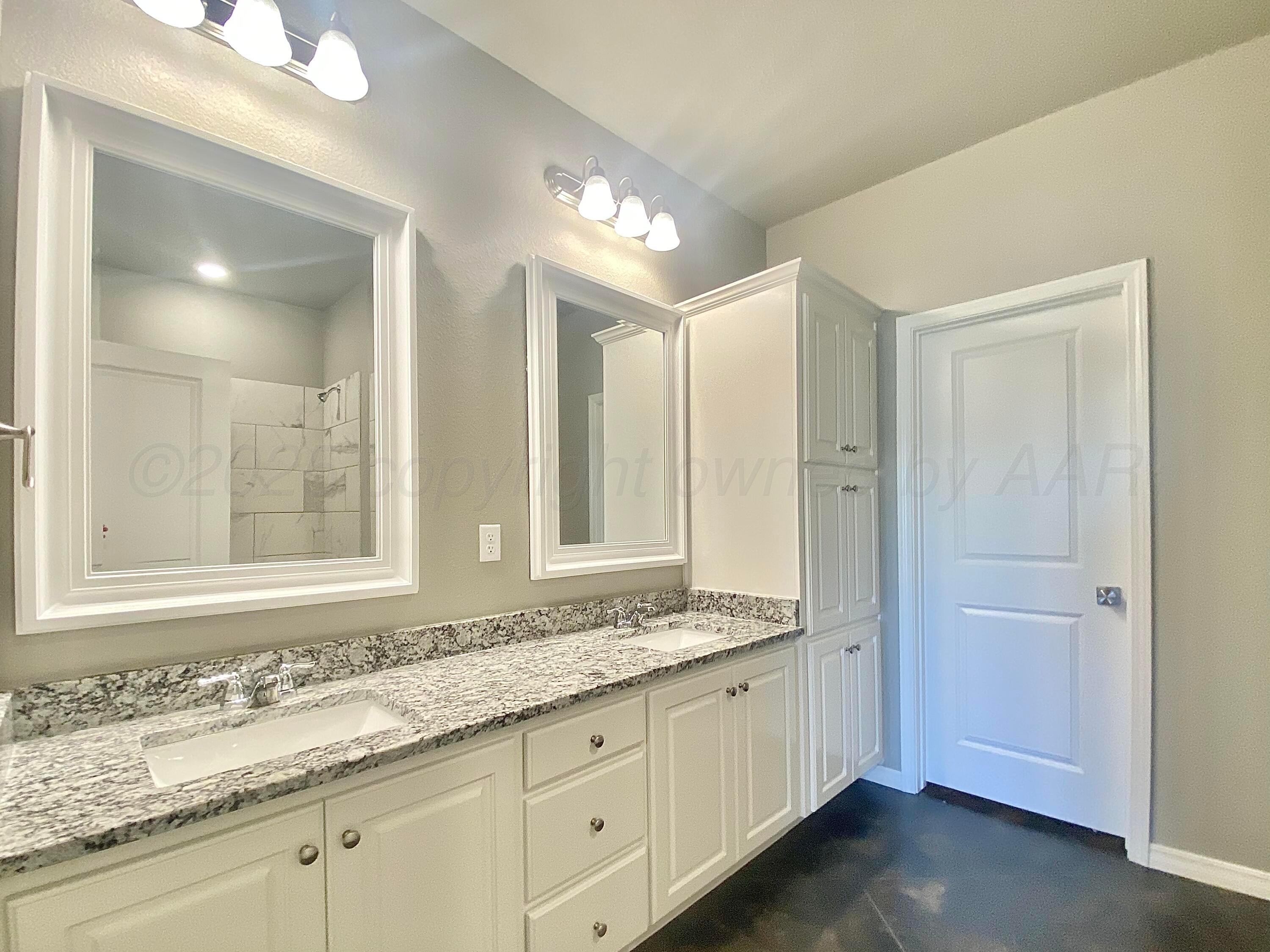 7517 John Thomas Street Amarillo, TX 79119 - Photo 10 of 20 a bathroom with a granite countertop sink mirror and double