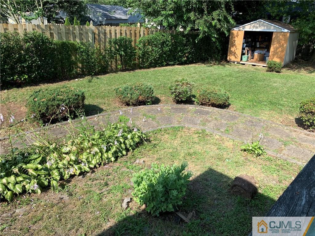 15 Sanders Road Edison, NJ 08817 - Photo 12 of 13 a view of a garden with an outdoor space