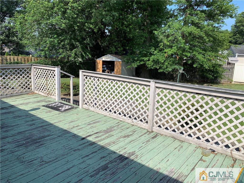 15 Sanders Road Edison, NJ 08817 - Photo 13 of 13 a backyard of a house with wooden floor