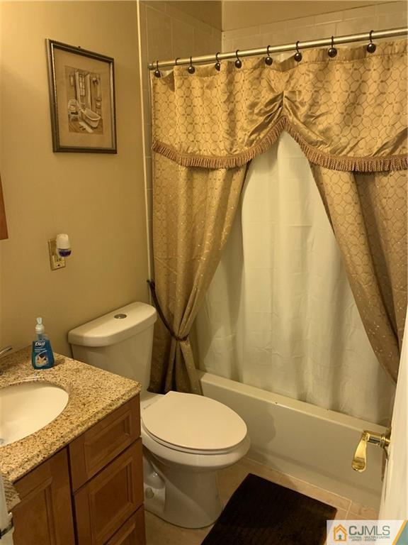 15 Sanders Road Edison, NJ 08817 - Photo 8 of 13 a bathroom with a granite countertop sink toilet and shower