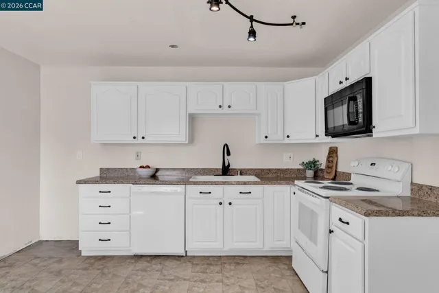 a living room with furniture and flat screen tv