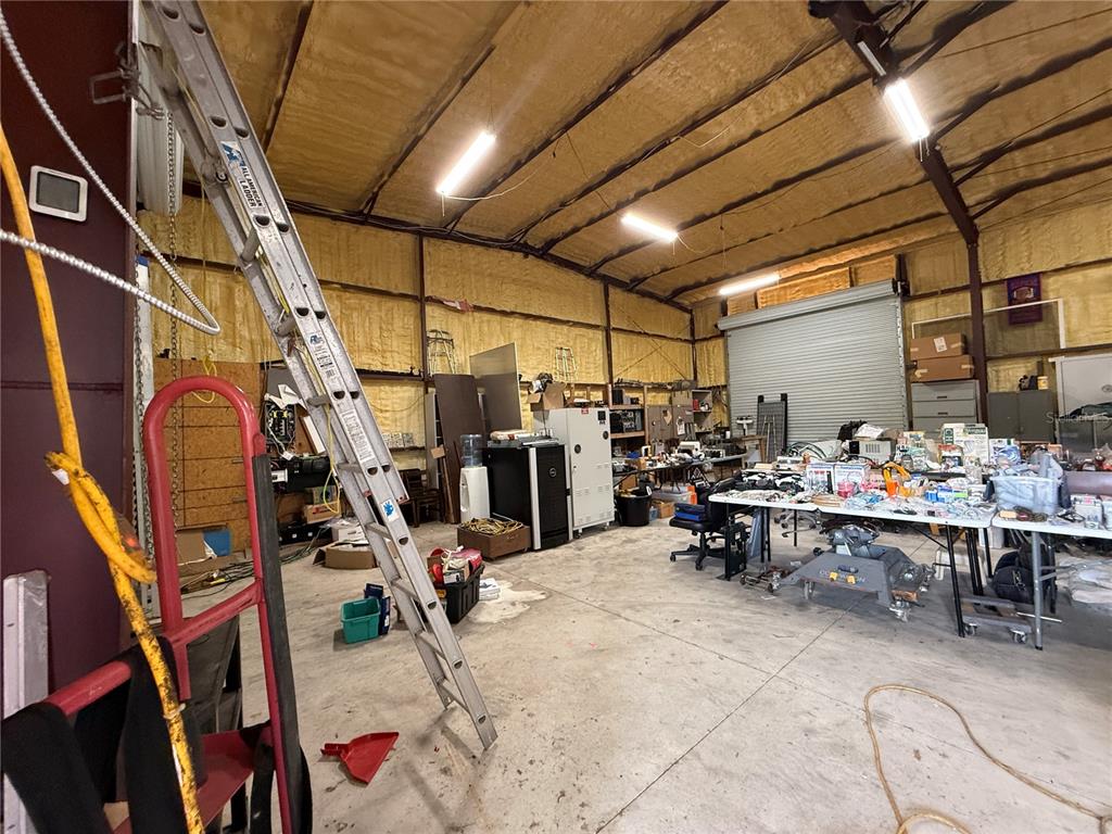 Southeast Sunset Harbor Road Weirsdale, FL 32195 - Photo 15 of 19 a view of a room with gym equipment