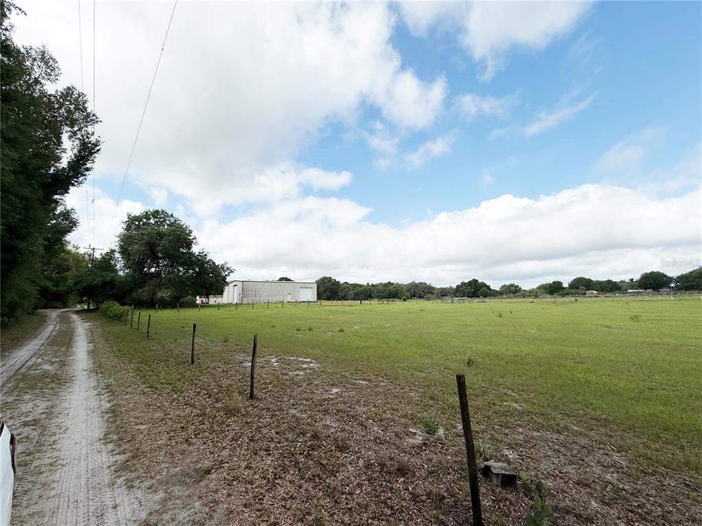 Southeast Sunset Harbor Road Weirsdale, FL 32195 - Photo 2 of 19 a view of a lake with a big yard