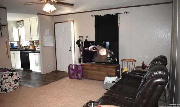 a room with furniture and wooden floor