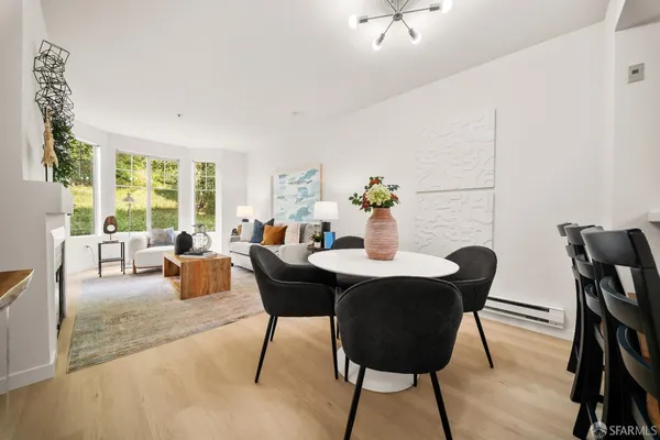 a view of a dining room with furniture window and outside view