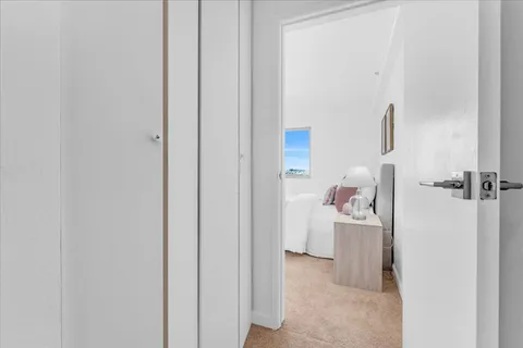 a walk in closet and a bathroom