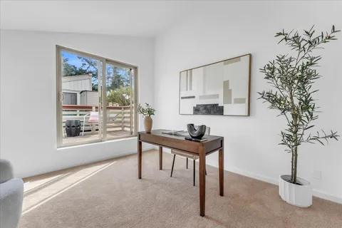 a view of a livingroom with furniture and window