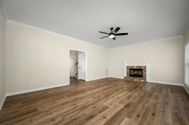wooden floor with a ceiling fan and wooden floor in a room
