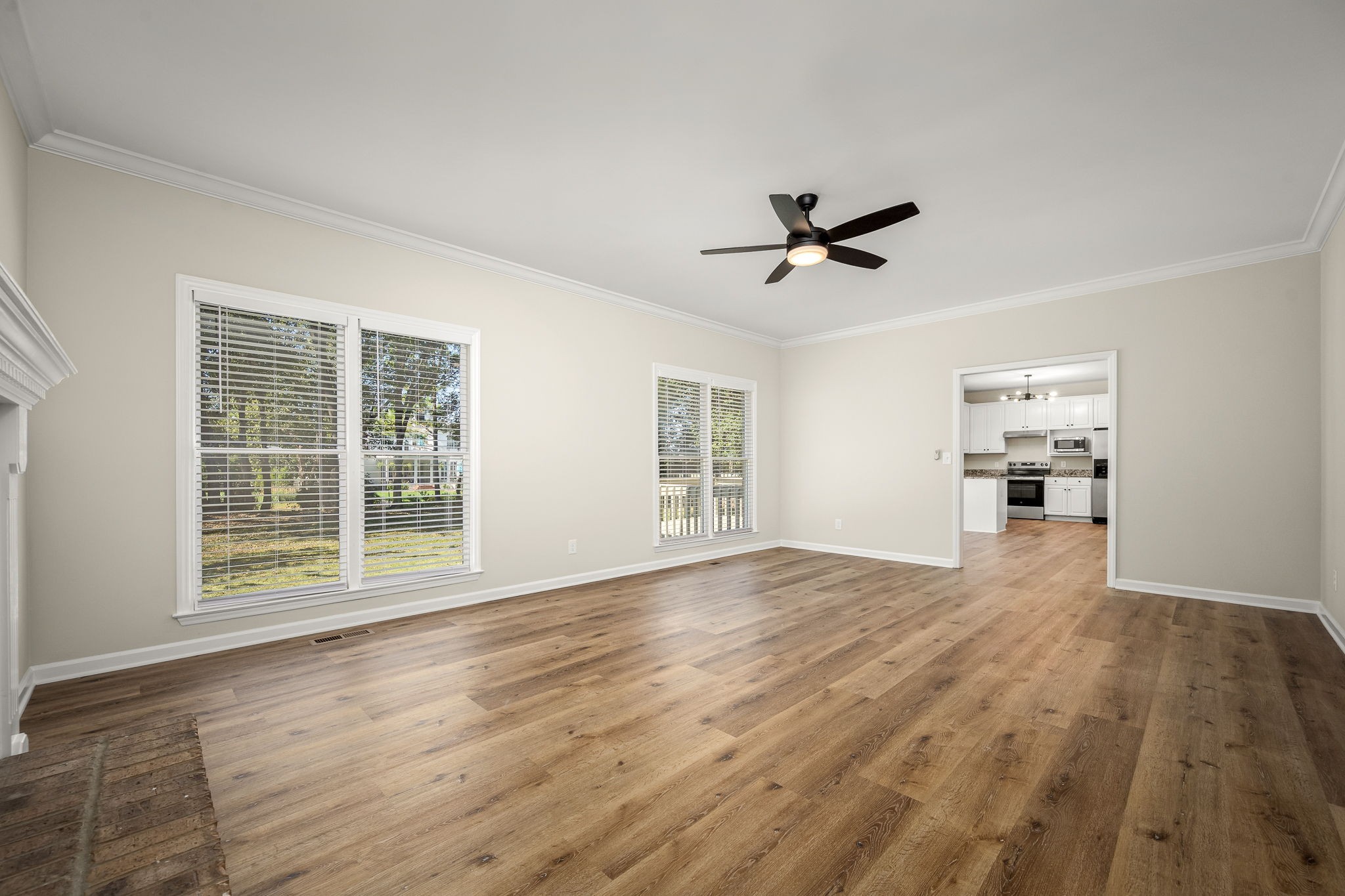 2923 Regenwood Drive Murfreesboro, TN 37129 - Photo 12 of 34 a view of an empty room with a window and wooden floor