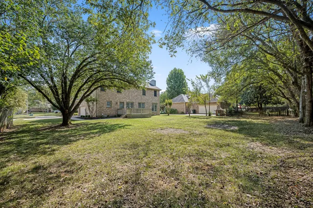 a view of backyard with green space