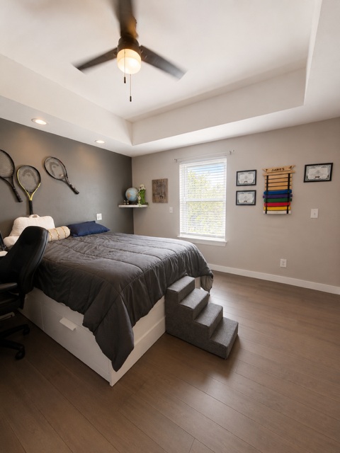 221 Winding Way Road Marble Falls, TX 78654 - Photo 17 of 19 A restful bedroom offers recessed lighting and elegant tray ceilings. Space for a desk is a great addition to this room.
