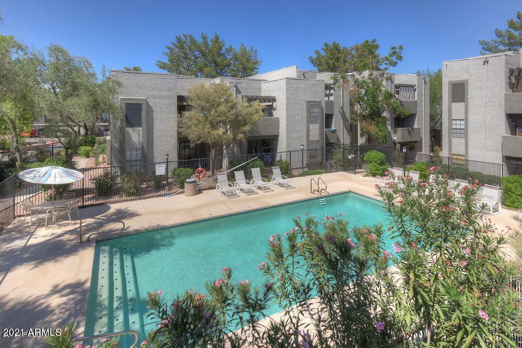 8020 East Thomas Road, Unit 226 Scottsdale, AZ 85251 - Photo 1 of 16 a front view of a house with garden