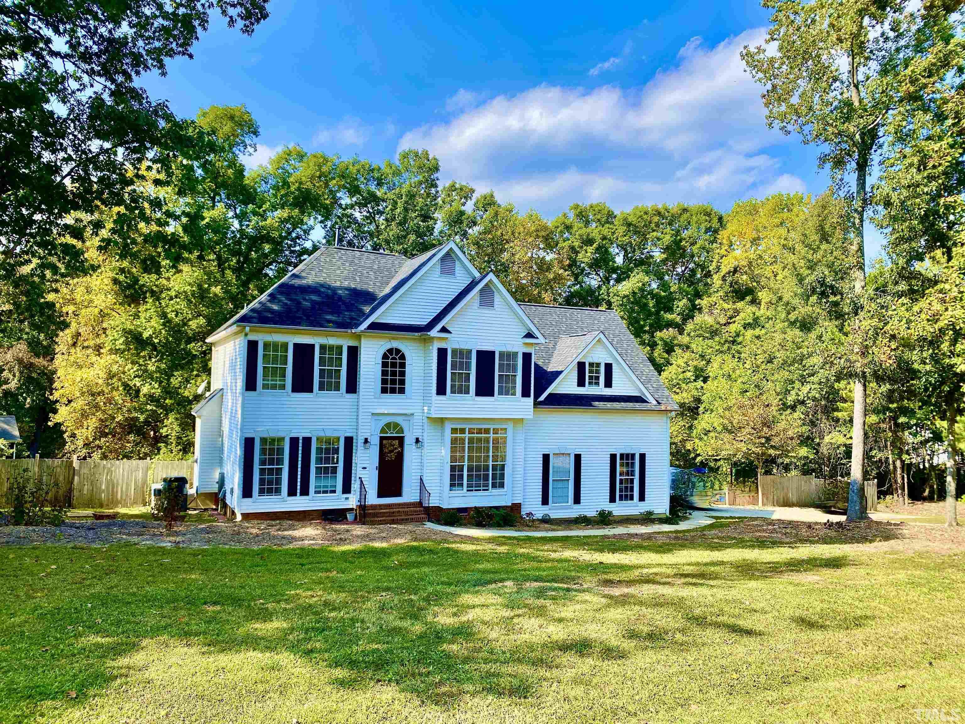 1201 Red Brick Road Garner, NC 27529 - Photo 4 of 71 a front view of a house with a yard