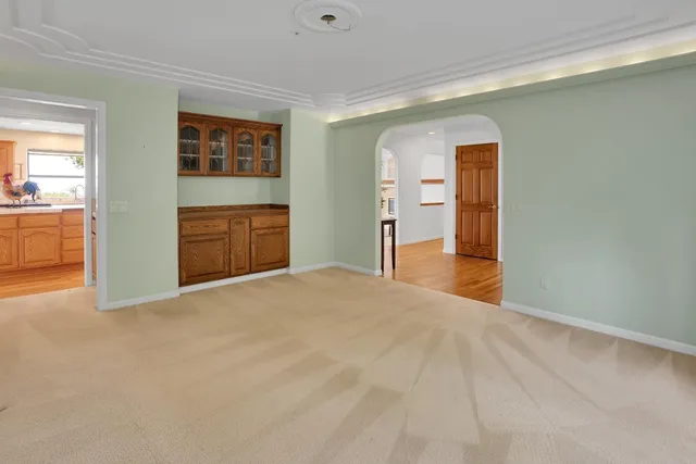 a bed room with a bed and a chair