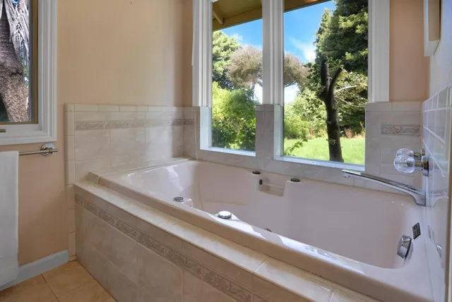 a white refrigerator freezer sitting inside of a kitchen