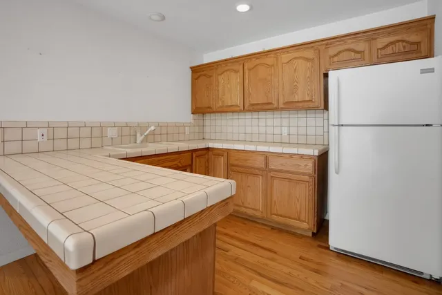 a spacious bathroom with a double vanity sink and mirror