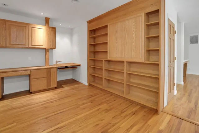 a view of backyard with a barn and a large cactus tree