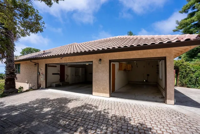 a front view of a house with a yard and porch