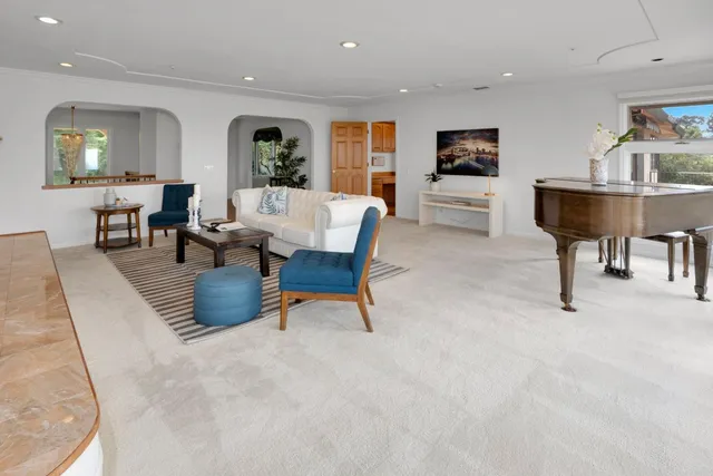 a kitchen with wooden floors and wooden cabinets